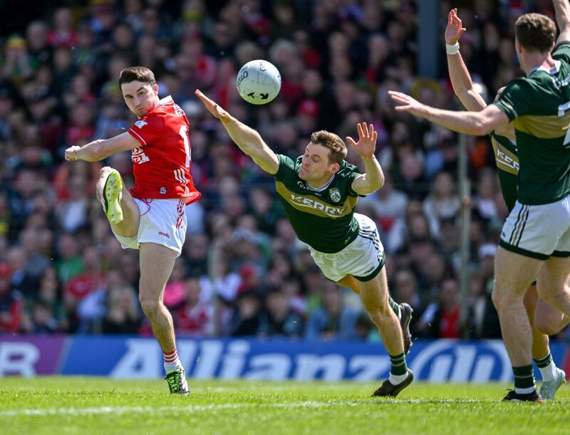 Chris Óg Jones of Cork shoots despite the efforts of Gavin White of Kerry. Picture: Paul Phelan/Sportsfile Chris Óg Jones of Cork shoots despite the efforts of Gavin White of Kerry. Picture: Paul Phelan/Sportsfile