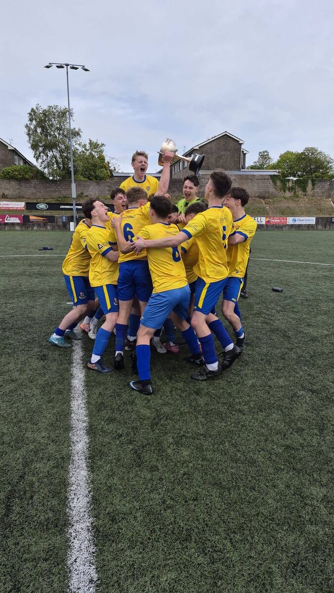 The Carrigaline United U18 Premier players enjoying their moment after winning the League title.