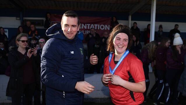 <p>Ciara Dwan of Presentation Secondary School Thurles after receiving her winner's medal from David Lenane, then FAI National Coordinator Women's Football following the Bank of Ireland FAI Schools Senior Girls National Cup Final match between Moville Community College, Donegal, and Presentation Secondary School Thurles. </p>
