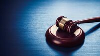 judge gavel on a blue wooden background