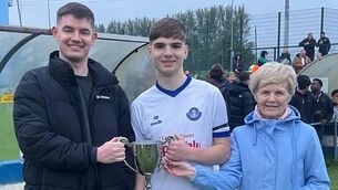 <p>Blarney United captain Sean Kennedy receives the U18 Sean Williams Cup from Darragh and Joan Williams after an excellent final against Passage at Castletreasure last Friday night.</p> <p>Blarney United captain Sean Kennedy receives the U18 Sean Williams Cup from Darragh and Joan Williams after an excellent final against Passage at Castletreasure last Friday night.</p>