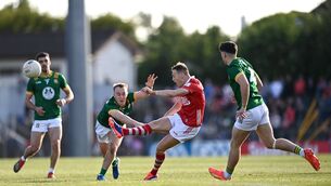 <p>STAR MAN: Steven Sherlock of Cork kicks a two-point score despite the tackle of Ronan Ryan of Meath. Picture: Ben McShane/Sportsfile</p>