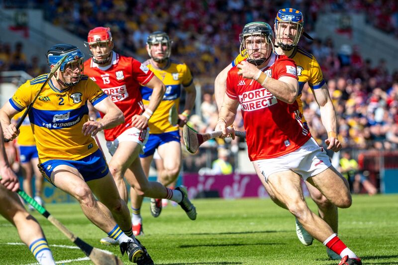 Mark Coleman drives past Clare’s David Fitzgerald. Picture: Chani Anderson