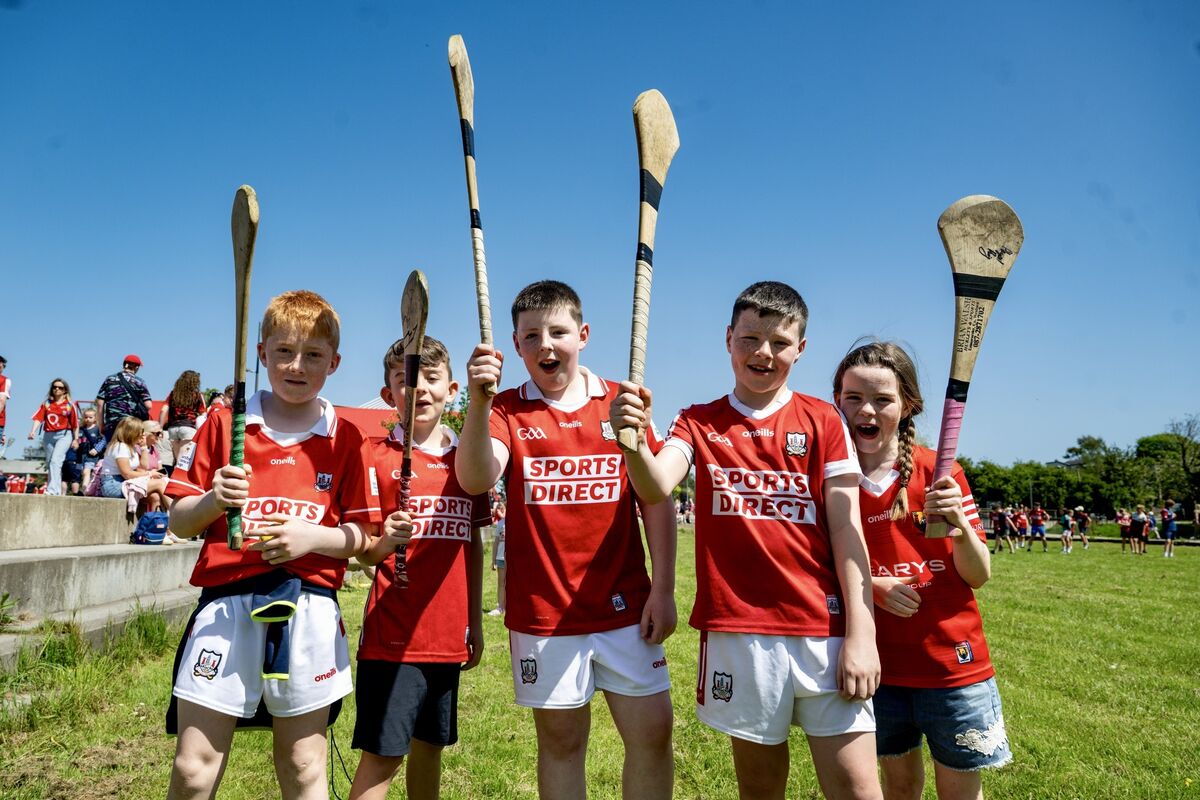 Cork fans Cian O’Connor, Levi Gore, Kyle Mulcahy, Oisín O’Sullivan and Fiadh O’Sullivan raise their hurleys before the game on Sunday. Picture: Chani Anderson Cork fans Cian O’Connor, Levi Gore, Kyle Mulcahy, Oisín O’Sullivan and Fiadh O’Sullivan raise their hurleys before the game on Sunday. Picture: Chani Anderson