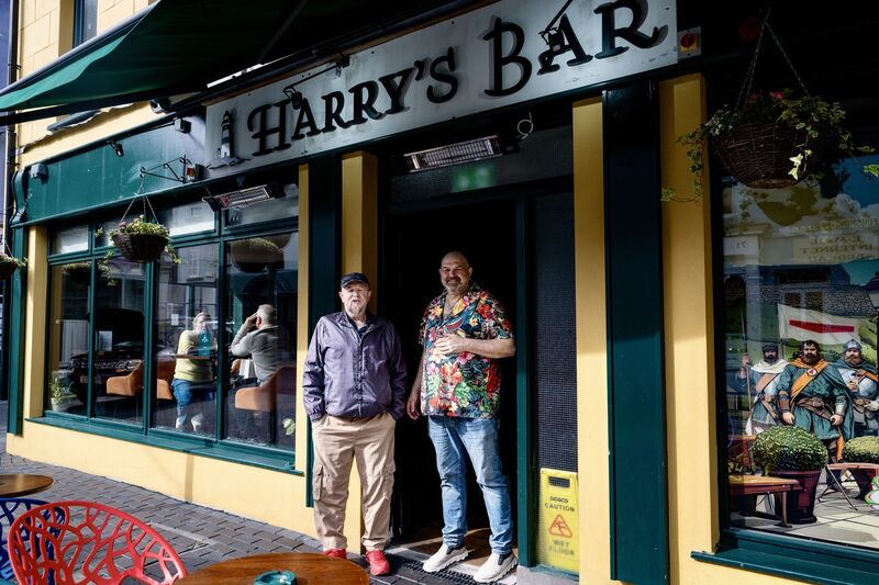 Graham D’Alton, owner of Harry’s Bar, pictured outside the pub in Kinsale with a regular customer. Picture Chani Anderson Graham D’Alton, owner of Harry’s Bar, pictured outside the pub in Kinsale with a regular customer. Picture Chani Anderson