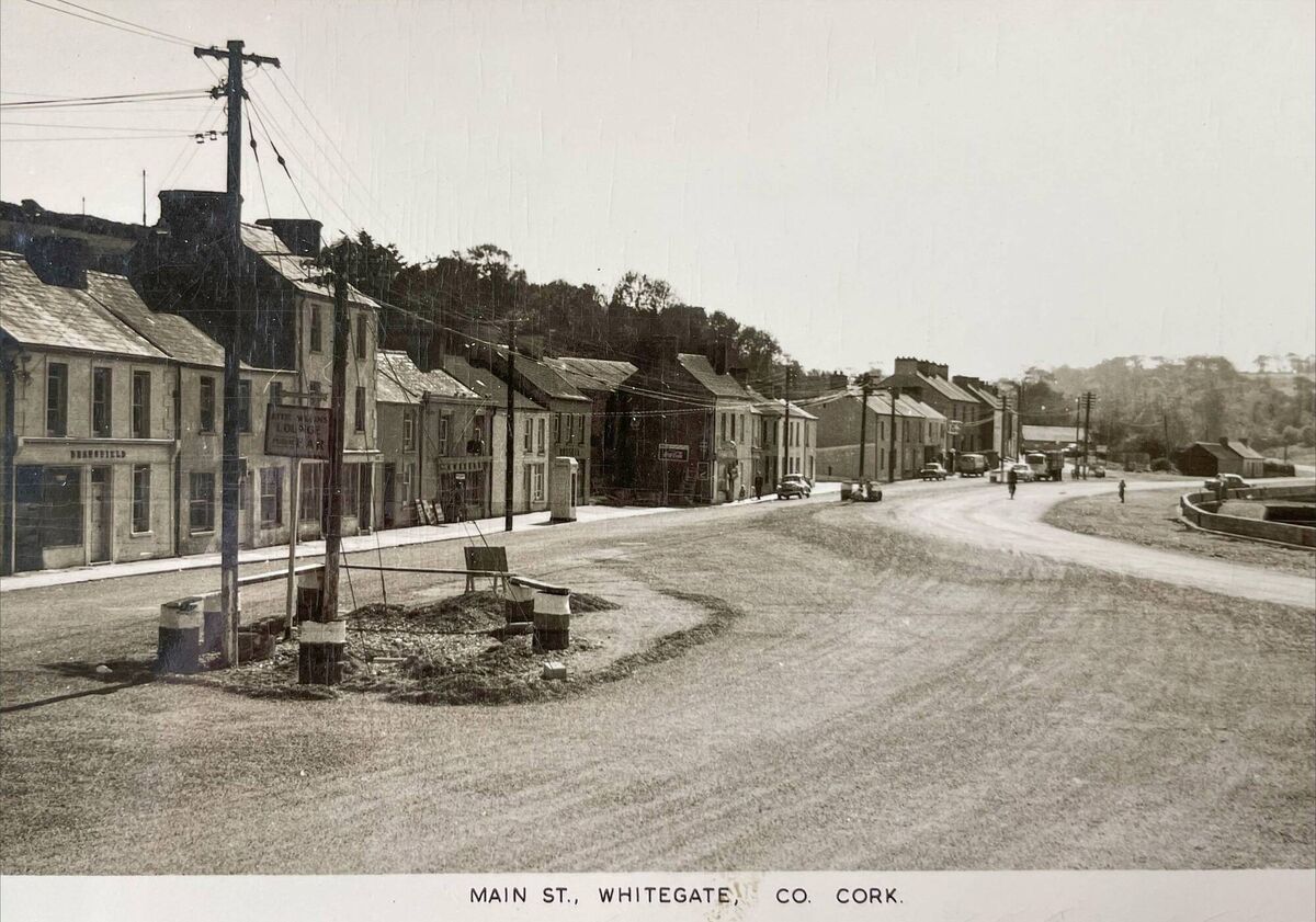 A postcard depicting the main street in Whitegate, Co Cork, as it was remembered by Micheál Kenefick A postcard depicting the main street in Whitegate, Co Cork, as it was remembered by Micheál Kenefick
