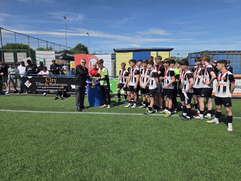 The Midleton captain Jack Mills receiving the Daly Industrial Supplies U17 Premier League trophy from Mr Eddie McEvoy from the Cork Youth League at Moneygourney. The Midleton captain Jack Mills receiving the Daly Industrial Supplies U17 Premier League trophy from Mr Eddie McEvoy from the Cork Youth League at Moneygourney.