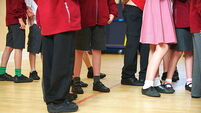 Primary or first school children at their school waiting for assembly