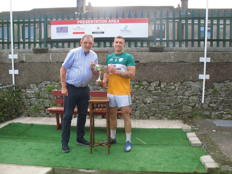 Seandún chairman Mick Buckley presents the trophy to Delanys winning captain Vinny Keating. Seandún chairman Mick Buckley presents the trophy to Delanys winning captain Vinny Keating.