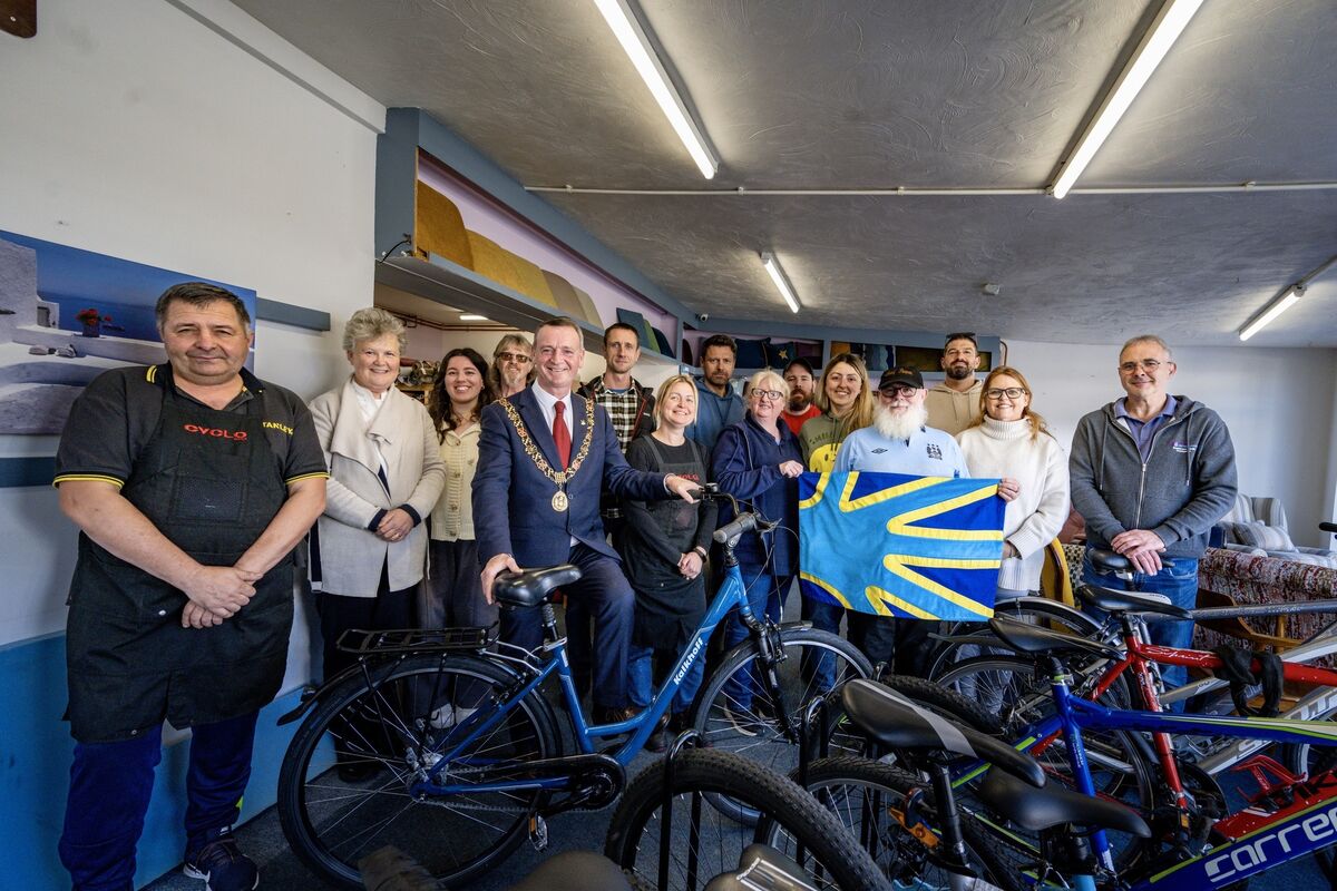 Lord Mayor Fergal Dennehy with members of the Deaf Enterprises team proudly holding the restored bicycle gifted to him during his visit to the centre in Ballinlough.	Picture: Chani Anderson
                    
