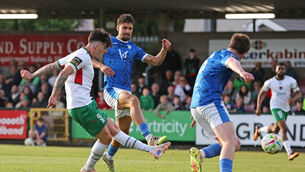 <p>ON SONG: Ruairí Keating, Cork City, gets his shot away to score the first goal, under pressure from Daniel De Lacerda (23) and Joel Bradley-Walsh, Finn Harps. Picture: Jim Coughlan.</p>