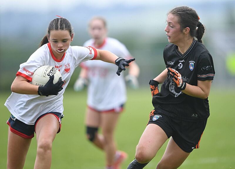 Beth Hegarty, Cork, holds off Saorlaith McParland, Armagh, in the U14 LGFA All-Ireland final. Picture: Gerard O’Loughlin Beth Hegarty, Cork, holds off Saorlaith McParland, Armagh, in the U14 LGFA All-Ireland final. Picture: Gerard O’Loughlin