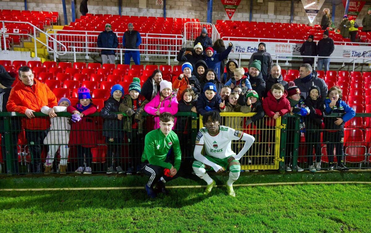 Jaden Umeh and Keelin Crowe with Ringmahon Rangers supporters at a Cork City game. Jaden Umeh and Keelin Crowe with Ringmahon Rangers supporters at a Cork City game.