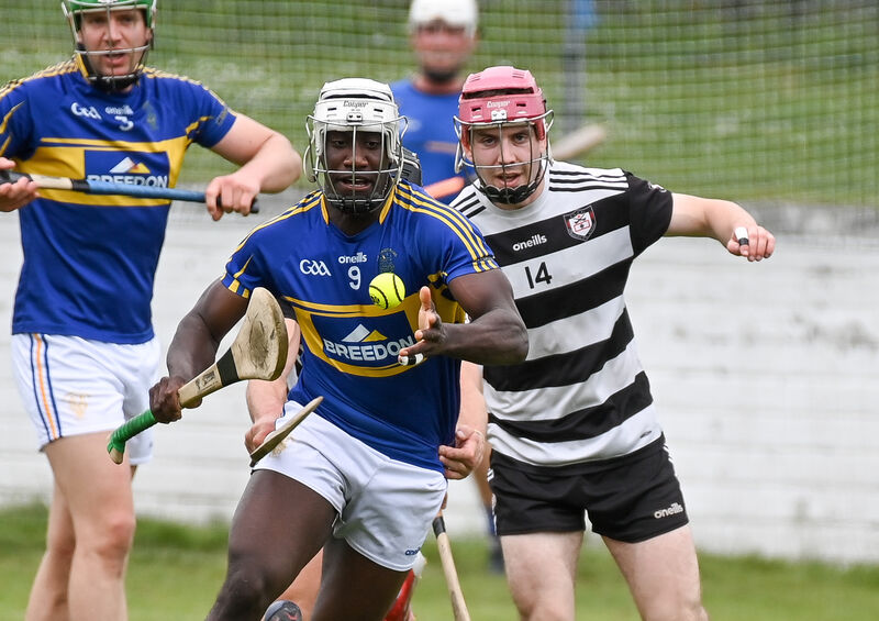 Carrigtwohill's Justin Oke tries to get away from Midleton's Alex Quirke. Picture: David Keane Carrigtwohill's Justin Oke tries to get away from Midleton's Alex Quirke. Picture: David Keane