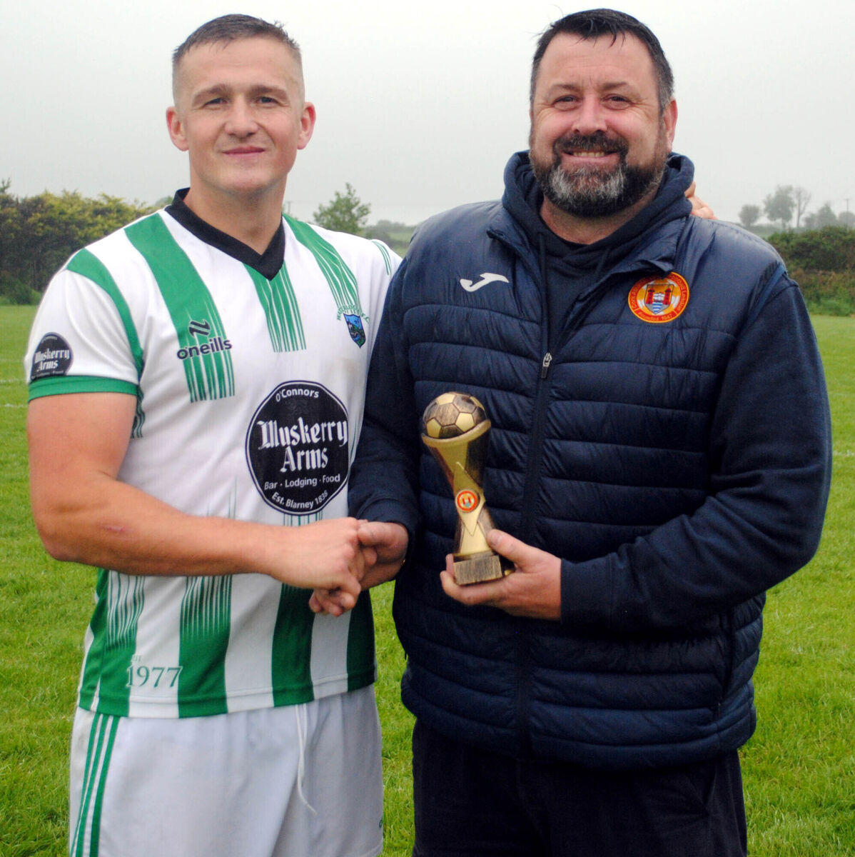 Paul Pepper (Cork AUL) presents the man-of-the-match award (Sponsored by Gary McCarthy Trophies) to Waterloo's Scott Shine. Picture: Barry Peelo. Paul Pepper (Cork AUL) presents the man-of-the-match award (Sponsored by Gary McCarthy Trophies) to Waterloo's Scott Shine. Picture: Barry Peelo.