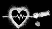 Heart, cardiogram, salt and salt shaker on black background