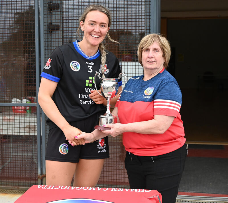 Mary McSweeney presents the trophy to Sarsfields captain Katie Barry. Picture: Eddie O'Hare Mary McSweeney presents the trophy to Sarsfields captain Katie Barry. Picture: Eddie O'Hare