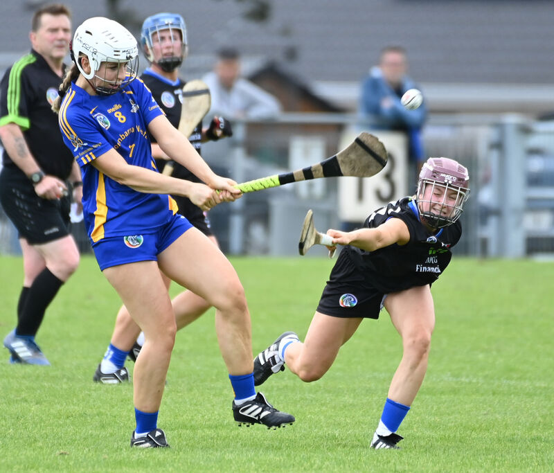 St Finbarr's Aoife Byrne clears from Sarsfields' Clare Mullins. Picture: Eddie O'Hare St Finbarr's Aoife Byrne clears from Sarsfields' Clare Mullins. Picture: Eddie O'Hare