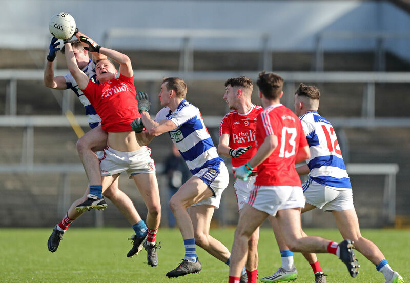 Killavullen's Liam Fox and Eoghan Buckley battle for the dropping ball with Paddy Ryan of Ballygarvan in 2023. Picture: Jim Coughlan
