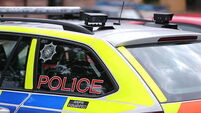 Man held on suspicion of attempted murder after police car driven at officer