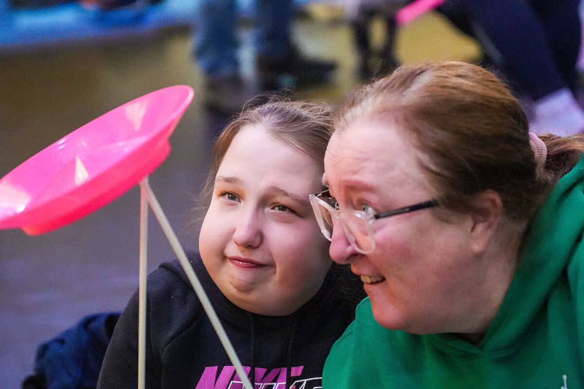 Sarah Dorney with her mother Maria Dorney spinning a plate.