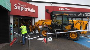 <p>Scene at SuperValu Mallow, Co. Cork after a JCB was used in an attempt to remove an ATM from the building. Picture: Michael Mac Sweeney</p>