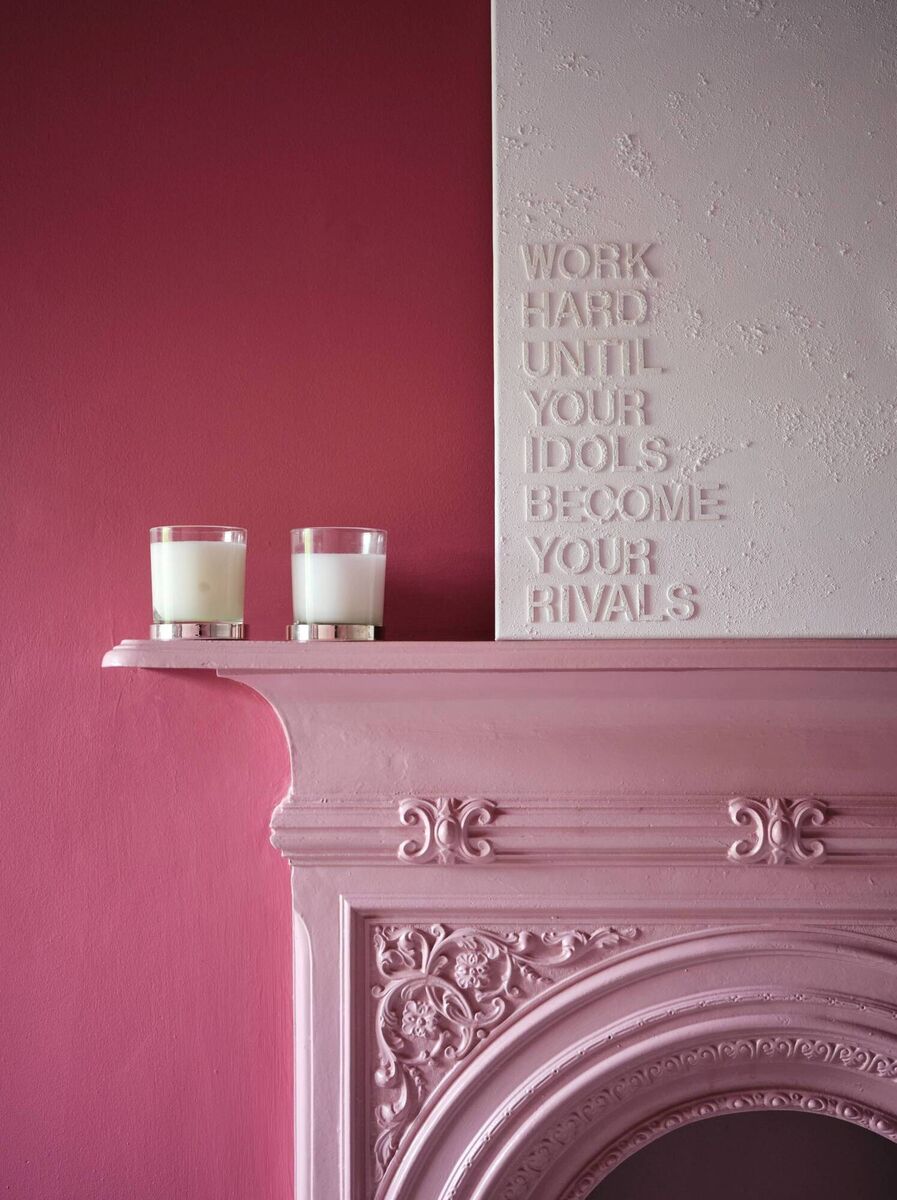 Dulux Heritage used Fitzrovia Red on one feature wall, and DH Blossom on the fireplace.