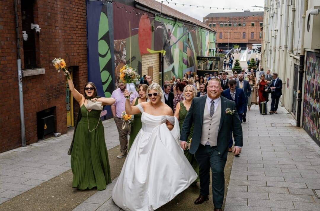 The wedding party en route to the Metropole Hotel. 