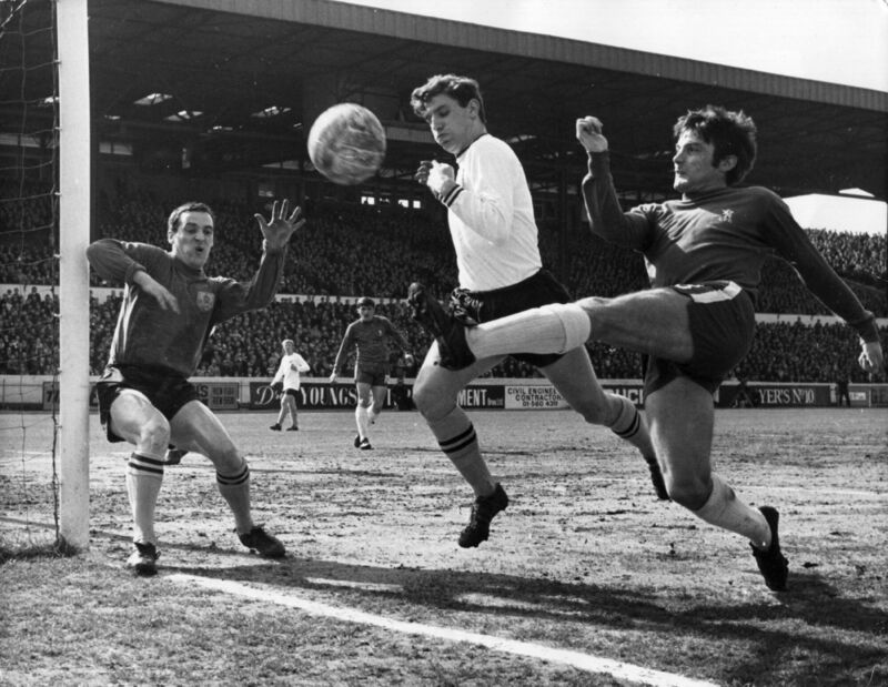 Bobby Tambling (right) of Chelsea tries a shot at goal from an acute angle, as Latcham of Burnley attempts to block him and goalkeeper, Thomson, covers his near post, during a match at Stamford Bridge. (Photo by Douglas Miller/Keystone/Getty Images) Bobby Tambling (right) of Chelsea tries a shot at goal from an acute angle, as Latcham of Burnley attempts to block him and goalkeeper, Thomson, covers his near post, during a match at Stamford Bridge. (Photo by Douglas Miller/Keystone/Getty Images)