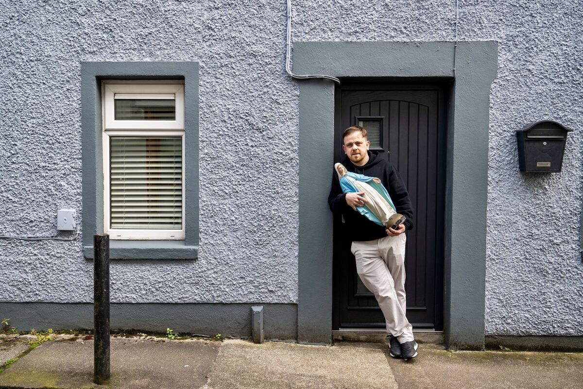 Craig Clinton pictured holding the statue of the Virgin Mary outside his late grandmother Kathleen O’Sullivan’s former home on Cathedral Avenue.