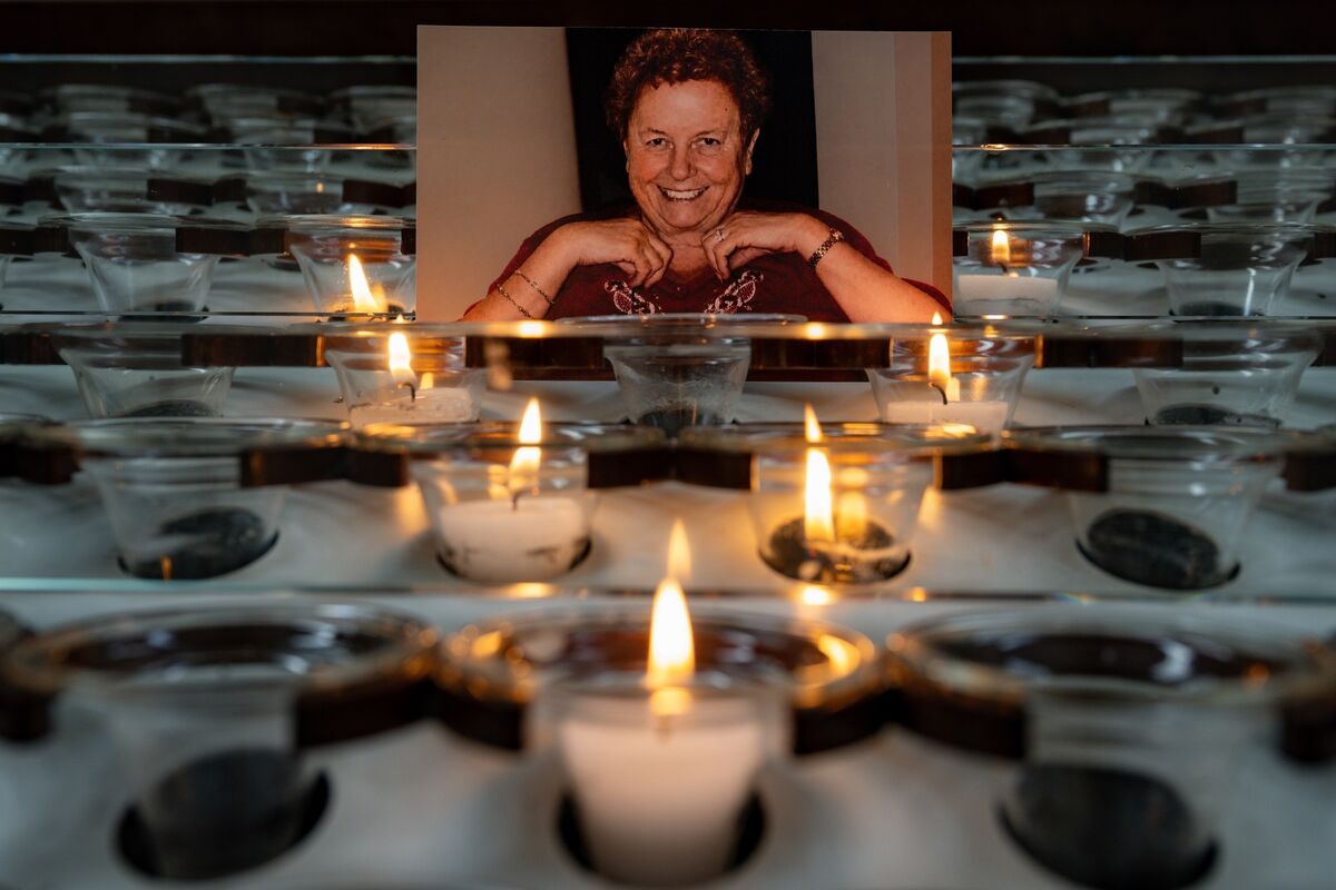 A photograph of the late Kathleen O’Sullivan surrounded by candles inside the Cathedral of St Mary and St Anne. Kathleen began the tradition of creating a Eucharistic altar outside her Cathedral Avenue home each year, a tradition now lovingly continued by her grandson Craig Clinton. 
