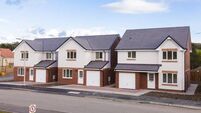 Row of new detached houses.