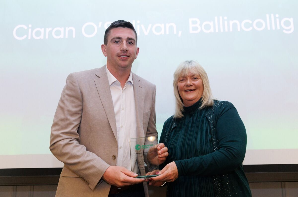 Ciaran O'Sullivan of Ballincollig receiving the Domino's Men's Super League Coach of the Year award from Breda Dick. Picture: INPHO/Tom Maher Ciaran O'Sullivan of Ballincollig receiving the Domino's Men's Super League Coach of the Year award from Breda Dick. Picture: INPHO/Tom Maher
