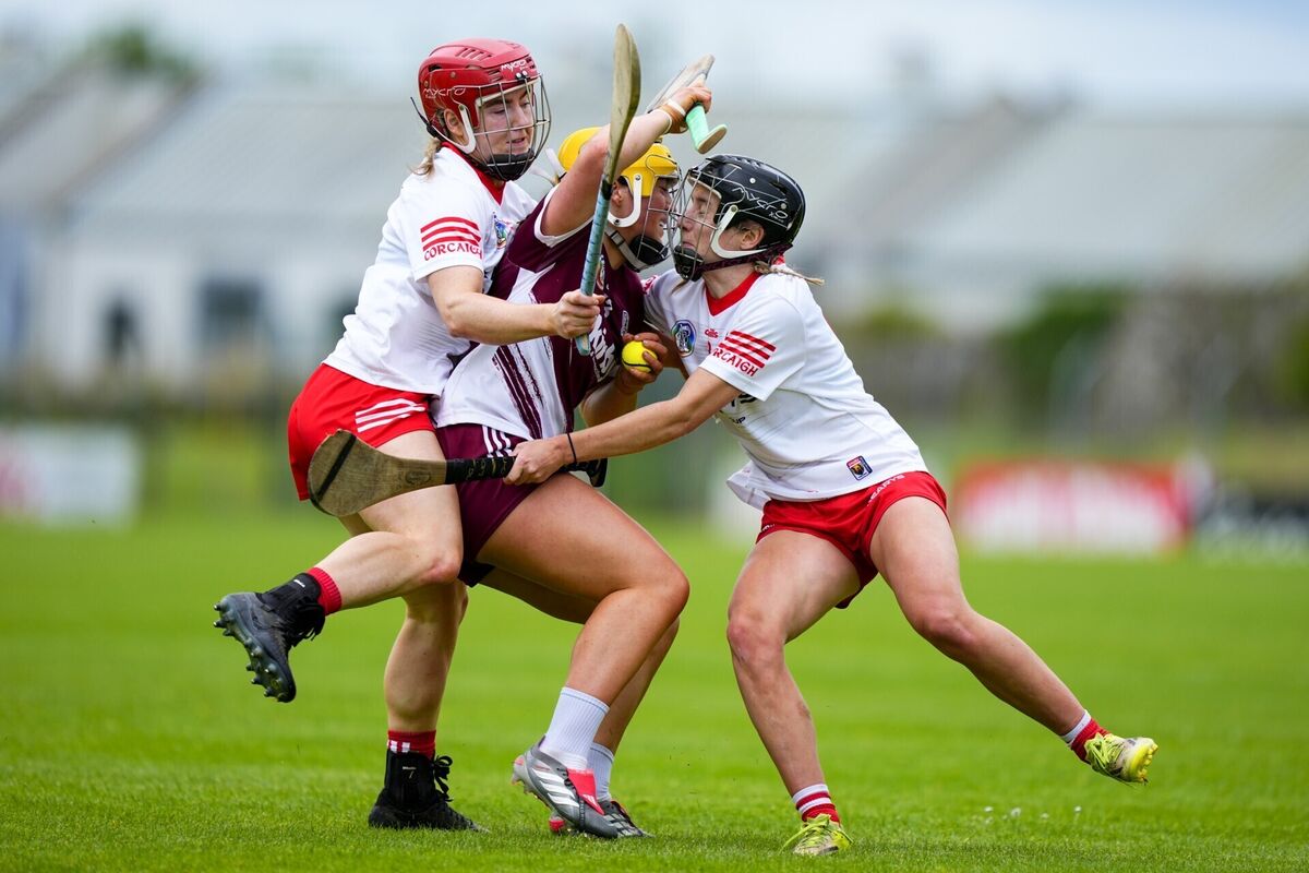 Shannon Corcoran of Galway is tackled by Cork's Libby Coppinger and Millie Condon during their championship clash at Kenny Park. Picture: INPHO/James Lawlor