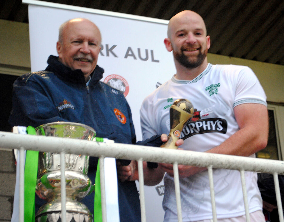 Martin Conlon presents the Man of the Match award (sponsored by Gary McCarthy Trophies) to Coachford's Sean O'Sullivan. Picture: Barry Peelo.
