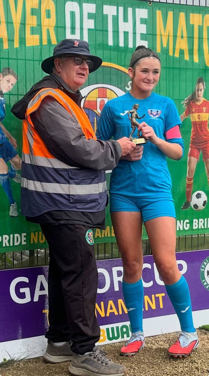 Gaynor Cup final player of the match Emma O’Neill being presented her award from SFAI member Neil Ahern. Gaynor Cup final player of the match Emma O’Neill being presented her award from SFAI member Neil Ahern.