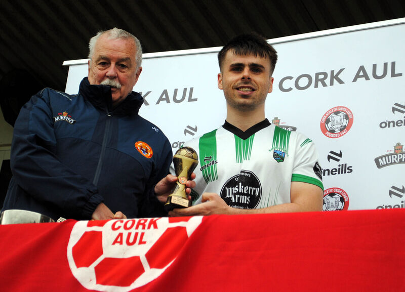 John Coughlan (Cork AUL) presents the man of the match award (Sponsored by Gary Mccarthy Trophies) to Waterloo's Jack O'Keeffe. John Coughlan (Cork AUL) presents the man of the match award (Sponsored by Gary Mccarthy Trophies) to Waterloo's Jack O'Keeffe.