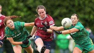 Nicola Ward is tackled by Ciara Smyth and Amy Gaffney 7/6/2026
