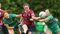Nicola Ward is tackled by Ciara Smyth and Amy Gaffney 7/6/2026