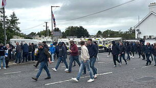 DUP MP defends photo with masked men at Scarva protest DUP MP defends photo with masked men at Scarva protest