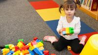 Toy Library.jpg Toddler is Playing With Blocks At the Library
