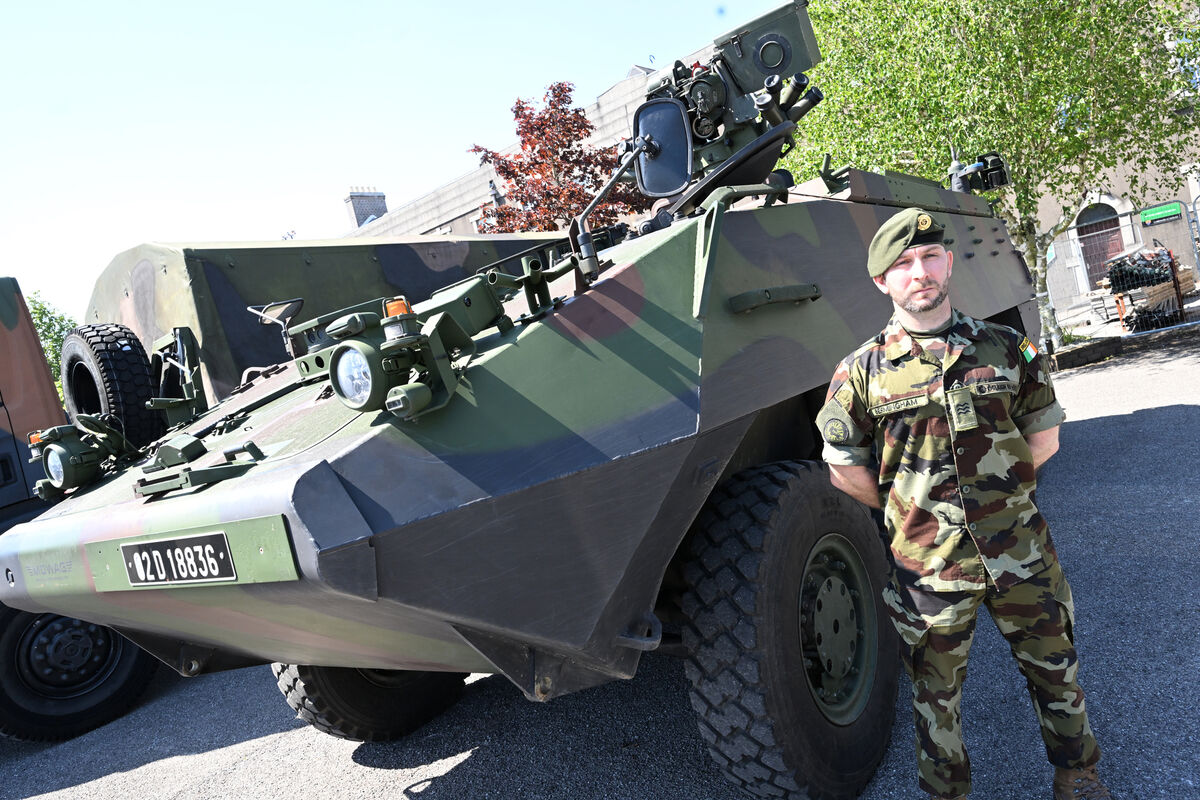 Sgt Martin Bermingham, 1st Cavalry Squadron beside a MOWAG armoured personnel carrier. Sgt Martin Bermingham, 1st Cavalry Squadron beside a MOWAG armoured personnel carrier.