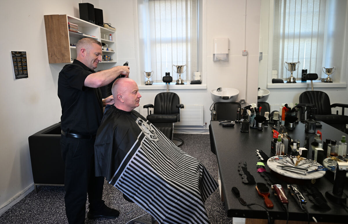 Gunner Jason McGroarty in the role of barber at Collins Barracks. Gunner Jason McGroarty in the role of barber at Collins Barracks.