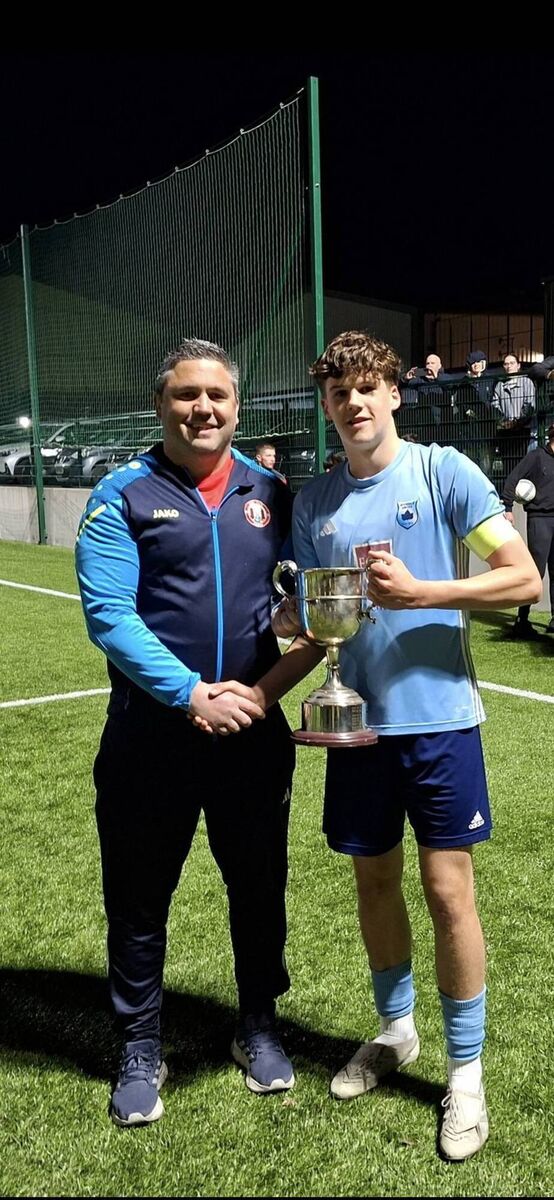 James Fogarty of the Cork Youth League presenting the Daly Industrial Supplies U17 League 1 Cup to Avondale United captain Harry Spratt after their playoff game against Fermoy at Carrig Park recently. KD James Fogarty of the Cork Youth League presenting the Daly Industrial Supplies U17 League 1 Cup to Avondale United captain Harry Spratt after their playoff game against Fermoy at Carrig Park recently. KD