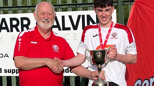 <p>Sean O’Sullivan chairman of the Cork Youth League presenting the Daly Industrial Supplies U18 League 1 Cup to Bandon captain Charlie Payne at their club grounds recently. KD </p> <p>Sean O’Sullivan chairman of the Cork Youth League presenting the Daly Industrial Supplies U18 League 1 Cup to Bandon captain Charlie Payne at their club grounds recently. KD </p>