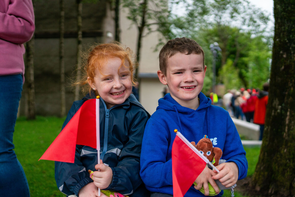 Grace Feehan and Sam Butler watch the Special Olympics Parade as it enters Bishop Lucy Park. Picture by Noel Sweeney