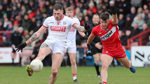 <p>Cork’s Seán Walsh scores a point as Derry's Shea Downey attempts a block. Picture: Lorcan Doherty/INPHO</p> <p>Cork’s Seán Walsh scores a point as Derry's Shea Downey attempts a block. Picture: Lorcan Doherty/INPHO</p>