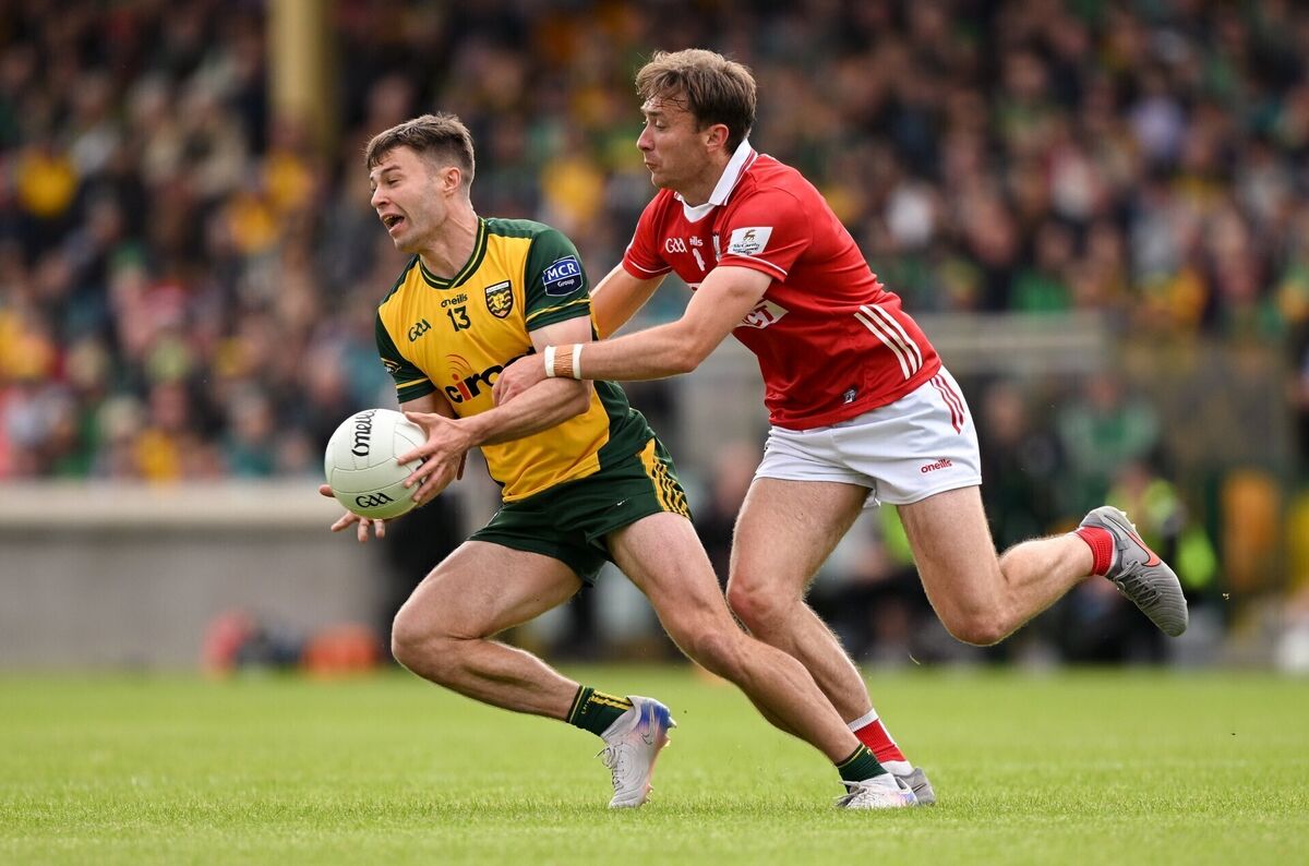 Conor O'Donnell of Donegal in action against Seán Meehan of Cork. Picture: Ramsey Cardy/Sportsfile