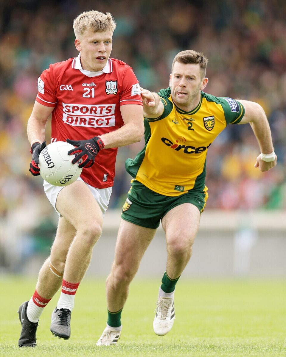 Cork's Dara Sheedy and Eoghan Bán Gallagher of Donegal in action. Picture: Laszlo Geczo/INPHO