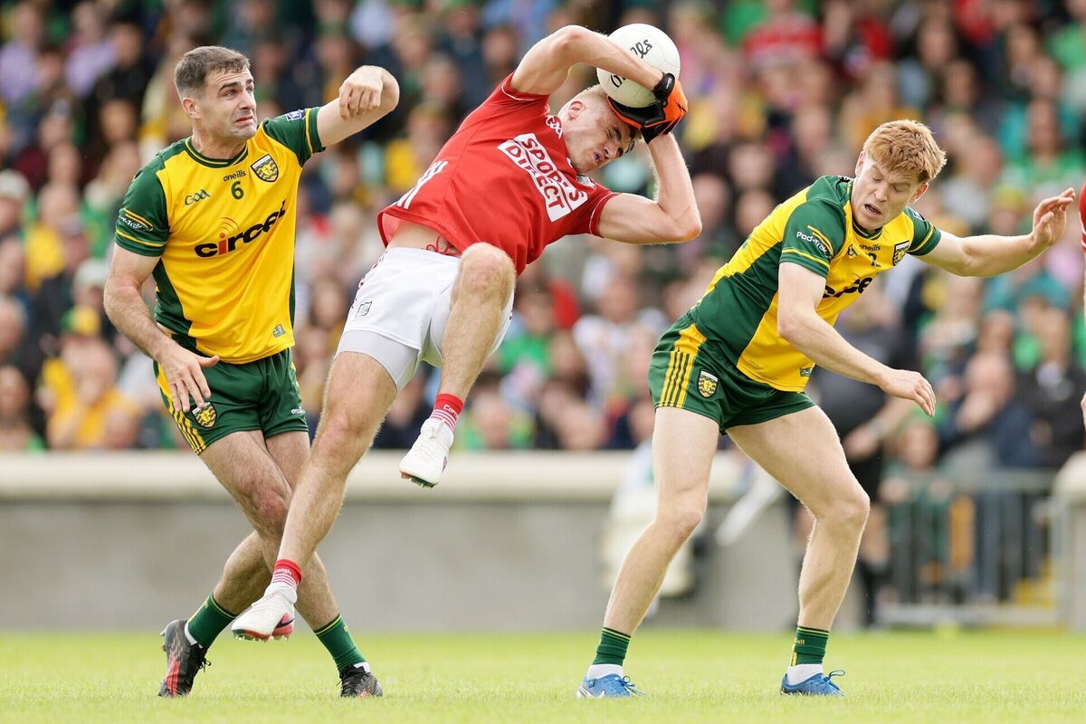 Cork's Ian Maguire with Caolan McGonagle and Ciarán Moore of Donegal. Picture: Laszlo Geczo/INPHO Cork's Ian Maguire with Caolan McGonagle and Ciarán Moore of Donegal. Picture: Laszlo Geczo/INPHO